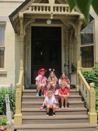 Kids sitting on the steps at ANHS